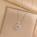Elegante zilveren hartketting met dubbellaagse fonkelende strassteentjes op sieradendoos - Bewegend Hart / Staalkleur