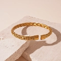 Golden woven mesh metal open cuff bracelet with polished ends in vintage style - Steel Twisted / Gold