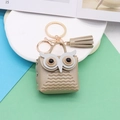 Mini champagne gold leather owl coin purse keychain with metallic tassel decoration - Gold