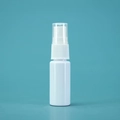 White plastic spray bottle for perfume with transparent cap on blue-green background - 20ml / Porcelain White Bottle White Spray