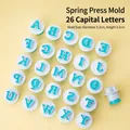 26-piece set of teal and white plastic alphabet cookie cutters for baking and DIY - 26 Uppercase Letters Spring Press Mold