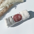 Cream pleated cotton viscose scarf roll featuring a floral handmade paper band - Style #100
