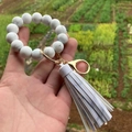 Detail of colorful silicone beaded keychain with marble patterns and leather tassel - Style 15-Marble White/Grey White Print Tassel