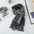 Knit scarf in dark grey gradient with fringe trim placed with lifestyle decor - 200*68CM / Medium Grey