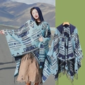 Ethnic style hooded shawl with tassels in blue and black pattern displayed on a model - 140x159cm / Blue