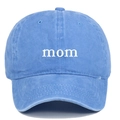 Detailed view of white 'mom' embroidery on a washed blue cotton adjustable baseball cap - MOM / Light Blue