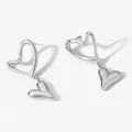 Elegant silver-toned heart drop earrings featuring double layered hollow heart charms - Silver (PD3419)