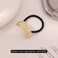 Minimalist gold metal hair tie with hammered texture and black high elastic band - Curved Irregular Embossed Gold