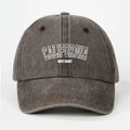 Close-up of washed grey cotton fabric with white California West Coast printed text - Adjustable / Coffee