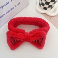 Plush red coral fleece bow headband with black OMG embroidery for washing face - Red