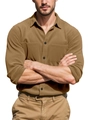 Detail of tan corduroy shirt with double chest pockets and black buttons on the fabric - Camel