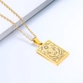 Detailed macro shot of a gold Taurus zodiac rectangle pendant with celestial engravings - Taurus / Gold