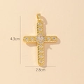 Macro shot of gold cross pendant with clear cubic zirconia showing 4.3cm by 2.8cm size - Style E-Clear Zirconia Cross
