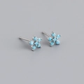 Detail view of flower-shaped S925 sterling silver earrings with turquoise zircon stones - Style D (Silver)