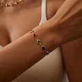 Colorful heart-shaped gemstone bracelet with gold plating on a female model wrist - Bracelet / Gold Multi-color