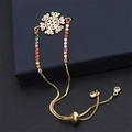Minimalist gold snowflake bracelet with multi-color zircons on blue jewelry box - Colorful Chain Snowflake