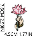 Macro detail of hand holding lotus embroidery patch with size measurements in CM and IN - Handheld Pink Lotus Style (No. 6)
