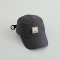 Detail of dark grey quick-dry five-panel cap with smiley patch and adjustable strap - 52cm / Gray