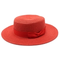 Close-up of bright red boater hat with fine straw weave and elegant ribbon bow detail - Red