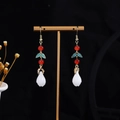 Macro detail of Chinese style drop earrings with red beads and white floral tassels - E4106 (Retro Red Bead Green Leaf)