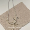 Minimalist white beaded pearl necklace featuring a small bow pendant design - White Bowknot Necklace