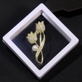 Macro detail of a golden tulip brooch with rhinestones and pearl in a floating display box - XZ214 Gold-Tulip Rhinestone-Boxed