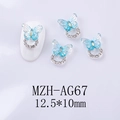 Detail of blue resin butterfly nail charm with silver base and tiny white rhinestones - Light Blue Aurora Butterfly Silver Base (AG67)