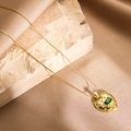 Elegant gold titanium necklace with a heart pendant featuring a green gem and diamonds - Gold Green Square Zircon Heart