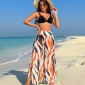 Three-piece bikini set with black halter top and abstract orange striped wide-leg beach pants - Black & Dark Striped Set