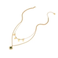 Double-layer golden necklace featuring a green square gemstone and colorful beads - Green Gem Layered Necklace