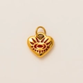 Detail of 18k gold heart pendant with red eye motif and radial engraved patterns - Heart Evil Eye Pendant