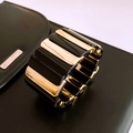 Elegant gold and black paneled elastic cuff bracelet in a modern geometric style - Black Gold Color Block Wide Bracelet