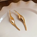 Close-up of golden liquid-metal drop earrings displayed on a white textured ceramic plate - Gold Fluid Minimalist Earrings (56#)
