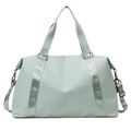 Close-up of mint green waterproof gym bag with reinforced handles and metal buckles - Light Green
