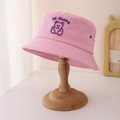 Detail of pink cotton bucket hat featuring purple cartoon bear embroidery and Hi there text - 50-52CM / Pink