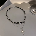Detail of layered silver necklace with black leather weave and diamond cross pendant - Silver Cross Style