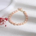 Elegant 14K gold pearl bracelet featuring light purple freshwater pearls and metal beads - Pink Rice Pearl Bracelet