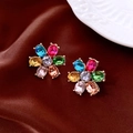 Close-up of vintage flower earrings with colorful rhinestones on dark brown silk - 925 Sterling Silver Pin Colorful Floral Stud Earrings