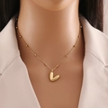 Polished gold stainless steel heart pendant necklace on minimalist beaded chain - Letter V