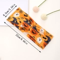 Detail showing dimensions of 8.5cm by 22cm for Halloween yoga pumpkin headband - Orange Halloween Doodle