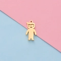 Close-up of a gold stylized boy charm pendant for DIY jewelry on a two-tone background - Boy - Gold