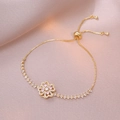 Detail of adjustable gold flower bracelet with pink and white cubic zirconia stones - Gold Pink Rotating Bracelet (TS0185)