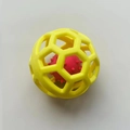 Pet hollow toy ball with yellow hexagonal outer frame and red inner spike ball - Yellow Ball-in-Ball