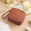 Brown waterproof PU leather square pouch with Sunny Girl text and convenient handle - Maillard Brown