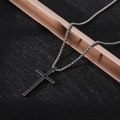 Close-up of hip-hop cross necklace with silver box chain and black enamel pendant - XL15 / Black Center Cross / Silver Black