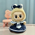 Labubu plush doll wearing a navy blue sailor outfit with white stripes and pleated skirt - British Style Schoolgirl Skirt / First And Second Generation Keychains Are Compatible With La Cloth Dolls. Dolls Not Included.