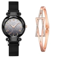 Dettaglio dell'orologio con quadrante stellato, cinturino nero e bracciale in oro rosa - Orologio Nero + Bracciale Oro Rosa