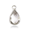 Macro shot of a teardrop-shaped glass birthstone pendant in a silver metal frame - Silver - April