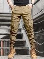 Detail einer khakifarbenen Cargohose mit Pattentaschen und Bündchen auf der Treppe - S / Khaki