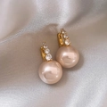Close-up of pearl drop earrings with champagne pearls and sparkling white zircons - Retro Pearl Studs - A1400 Gold + Rose Gold Bead